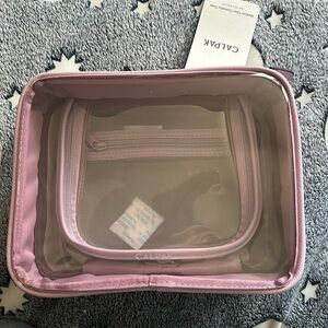 NWT clear Lavender Calpak medium size